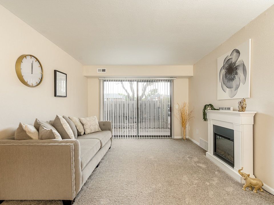 Living Room with Natural lighting at Three Oaks Apartments in Troy, MI