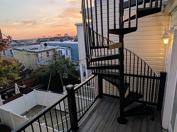 Balcony is made with premium Trex railing and deck and aluminum staircase.