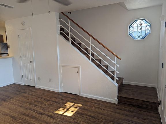 Stairs to bedrooms and door into downstairs washroom.