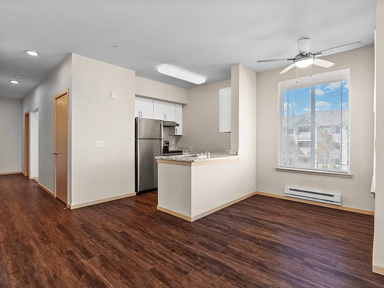 Step into style and comfort_this open-concept kitchen and dining area features sleek stainless steel appliances, gorgeous wood-style floors, and plenty of natural light. Step into style and comfort_this open-concept kitchen and dining area features sleek 