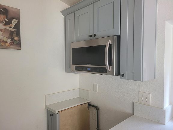 Over the range Samsung microwave.