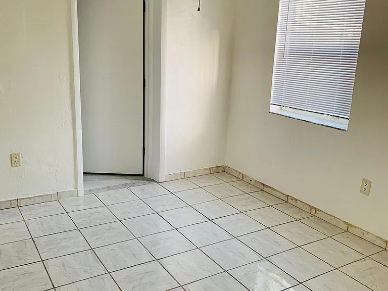 Master bedroom facing bathroom door