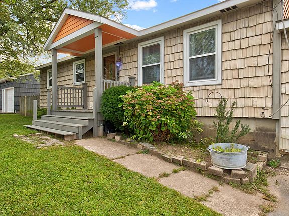 From the wide driveway, approach the front and stop up to a covered front porch deck. The smart vinyl siding gives all the charm of a cedar shake shingle exterior with none of the maintenance!