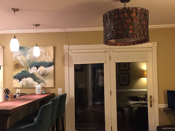 3 upholstered bar stools; door to private patio