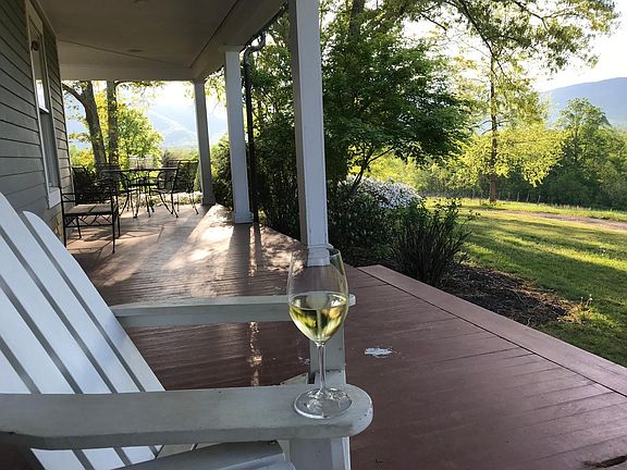 Enjoy a glass of wine while taking in the mountains.