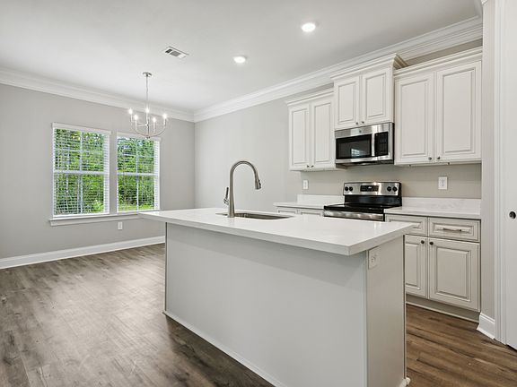 Kitchen in the Sandpiper floorplan at a Meritage Homes community in Gulfport, MS.