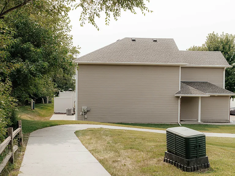 This path leads to the back patio of this end unit, and you are home!