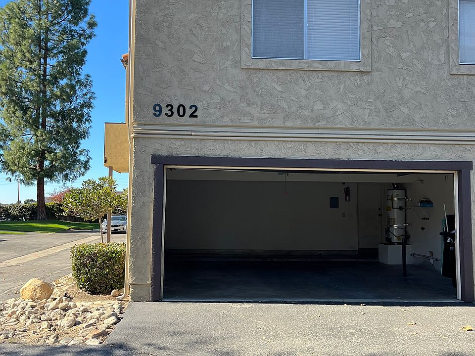 East side of building -Unit G garage door open
