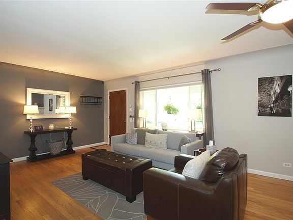 Tons of period charm throughout, with coved ceilings and hardwood flooring.