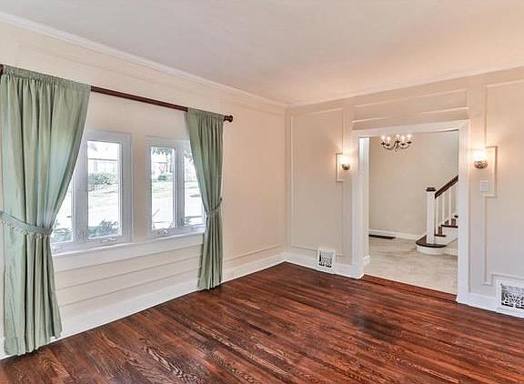 Living room with view of the entry foyer