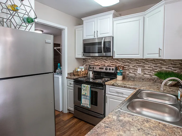 Indulge in our spacious, contemporary kitchens equipped with modern amenities.