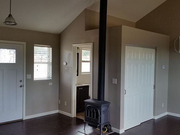 Propane stove for heat, wall a/c for cooling