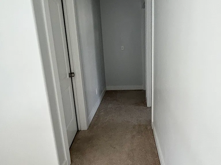 Hallway to guest bath and bedroom 2 and 3