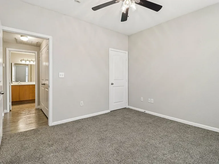 Spacious Bedroom with Ceiling Fan at Mission Hills Apartments, Texas, 78258