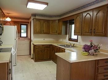 Lots of cabinets in a neat kitchen