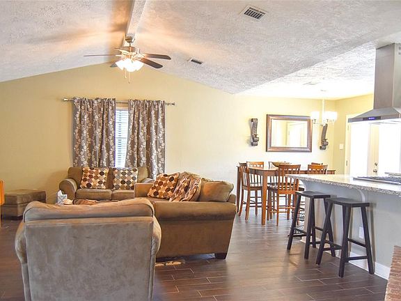 Oversized granite counter tops in the kitchen allow for addition seating; perfect for entertaining.