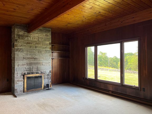 Living Room with wood burning fireplace.
