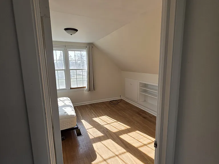 Upstairs Bedroom 2 - spacious closet as well as built-in cabinets for storage.