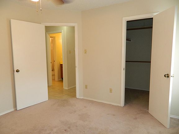 Mater and walk-in closet peeking towards the bathroom