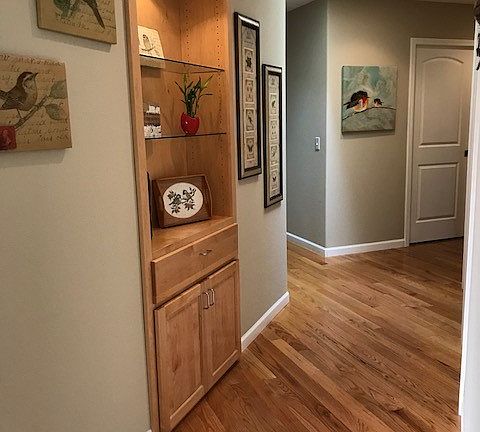 Custom lighted display cabinet in hallway.