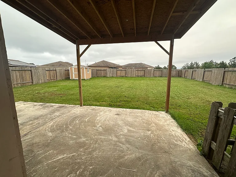 back yard with a shed.