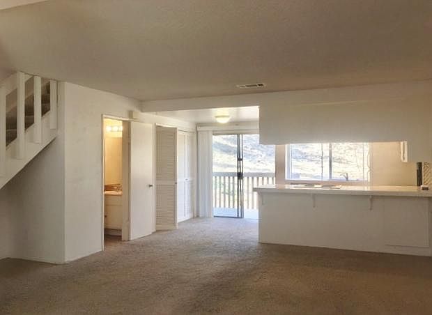 Open Floor plan with Sliders off to a balcony