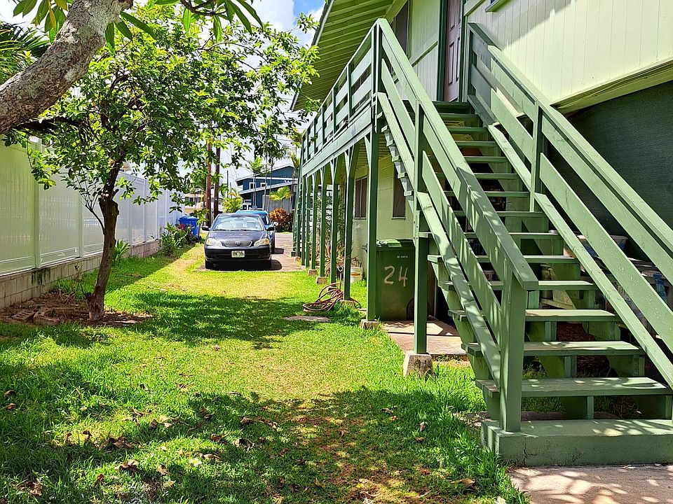 Left side of house stairs, to one bedroom unit.
