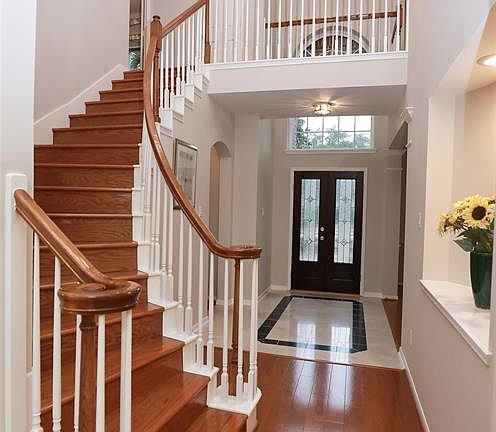 Stunning 2-Story Foyer with Natural Stone Flooring.