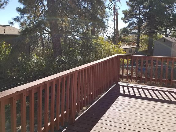 Deck off kitchen/dining area in backyard. (Note large tree in forefront) has since been removed.)