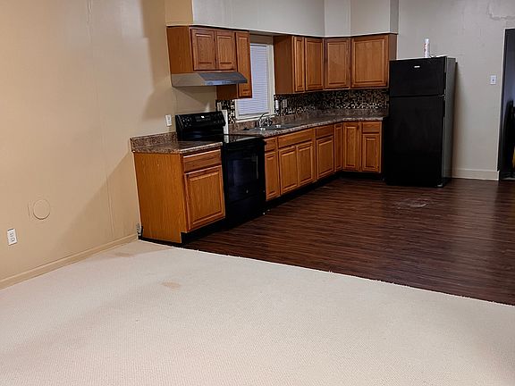 Open Living Room & Kitchen; garbage disposal, Fridge (no ice maker) and new Oven. No Dishwasher.