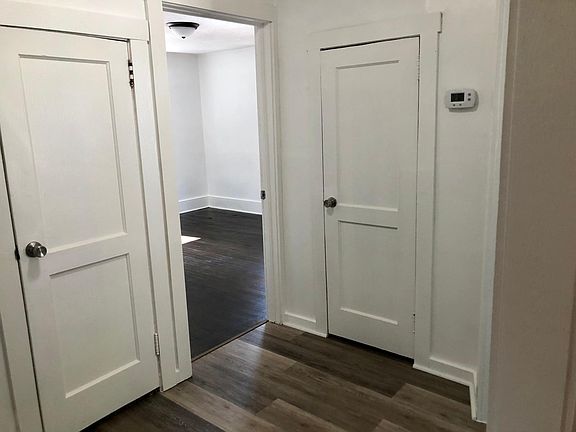 Hallway with 2 storage closets.