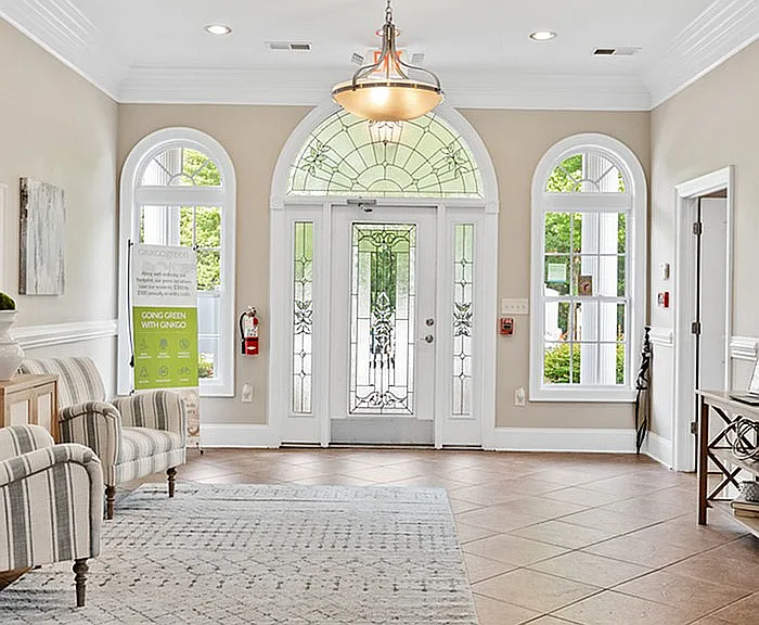 Step into elegance with this beautifully designed foyer featuring ample natural light.