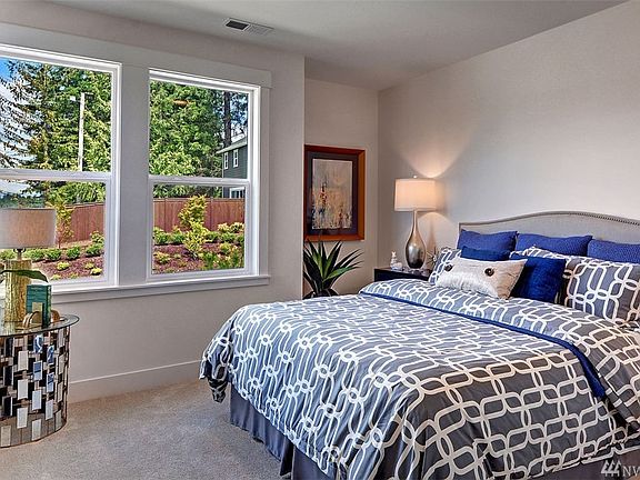 Spacious bedroom on the main level is perfect for guests or for an in-home office.