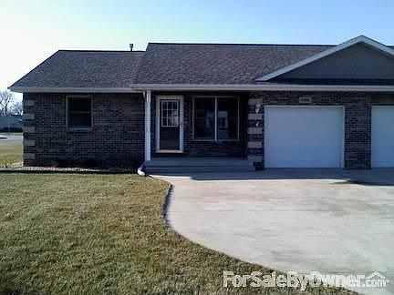 Front/outside view
						:
						Front view of condo. Brick exterior. Front porch.