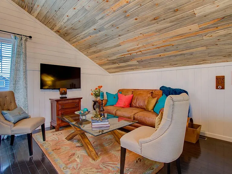 Your living room...note the vaulted blue stained pine ceilings and rich oak flooring