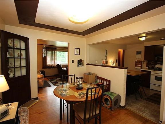 Gorgeous Hardwood Floors in Separate 11x9 Dining Room w/ Designed Tray Ceilings and opens Nicely into Kitchen & Living Room
