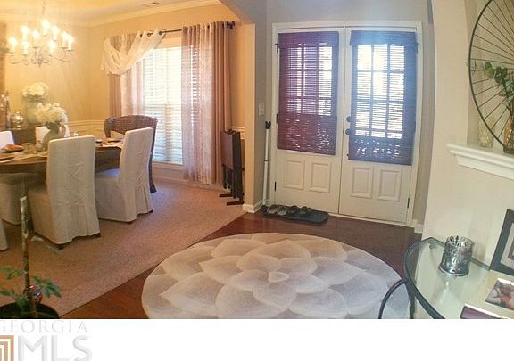 Foyer with gleaming hardwood floors.