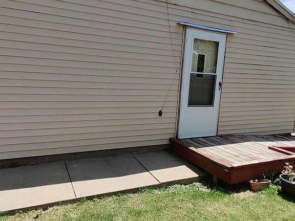 Side of house. Accessible ramp.