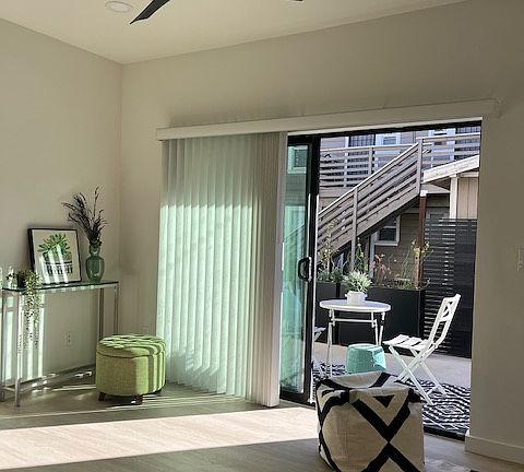 Open living room/dining/kitchen concept opens to the private 120 sq foot private patio that faces the yard space that is shared with a 4 plex.