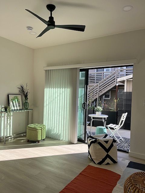 Open living room/dining/kitchen concept opens to the private 120 sq foot private patio that faces the yard space that is shared with a 4 plex.