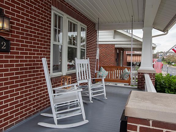 Enjoy your morning coffee or your evening cocktail from the front porch swing and rockers.