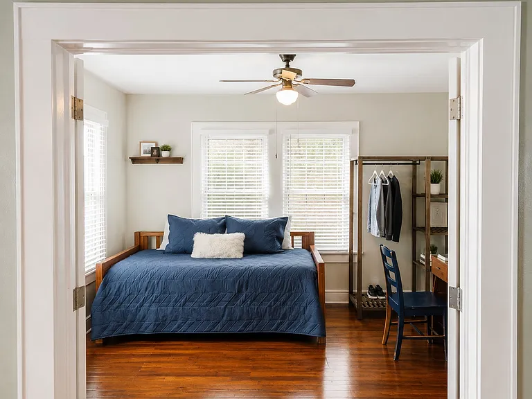 Bedroom #1 or Study off the main living area. Get's a lot of morning sun. Still has the vintage glass door knobs.