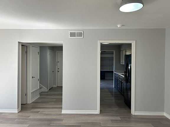 Opening on left is the entryway. Opening on Left is your kitchen both accessible from the living room.