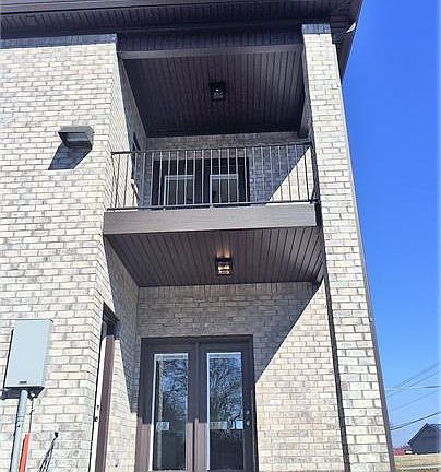 Upstairs covered balcony off of master and downstairs covered patio off of kitchen.