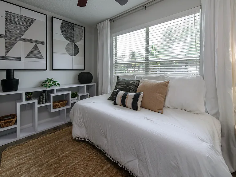 Wake up to the embrace of sunlight in this inviting bedroom at Emerson Isles.