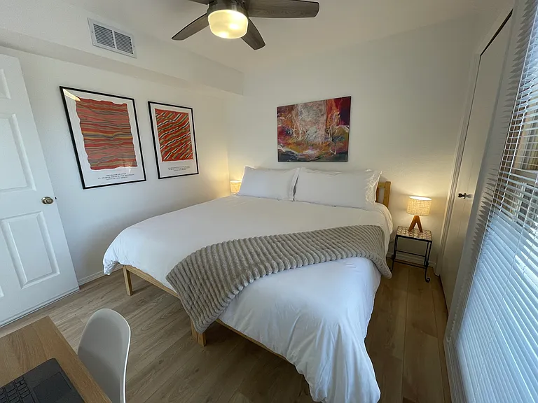Upstairs Bedroom in king bed configuration and dedicated workspace