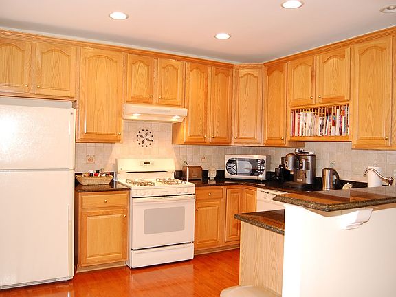 Kitchen with granite counters and maple hardwood floors
