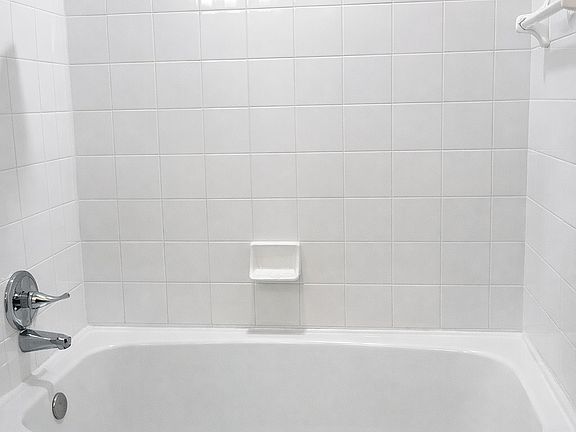 Modern bathroom with sleek bathtub and shower