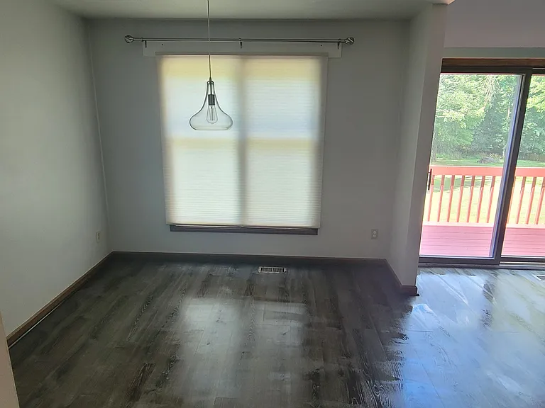 Looking in from the kitchen while standing at the door of the half bathroom is the dining room.