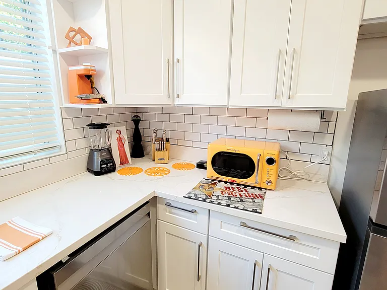 kitchen w/ microwave, blender, utensils, dishwasher